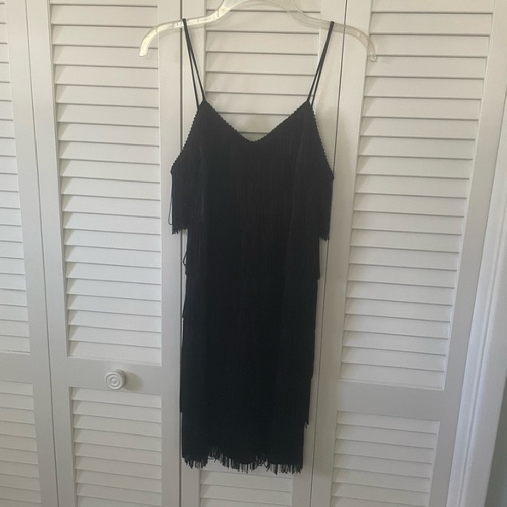 Vintage black fringe party dress. Size 9/10. All fringe intact, no rips, tears.